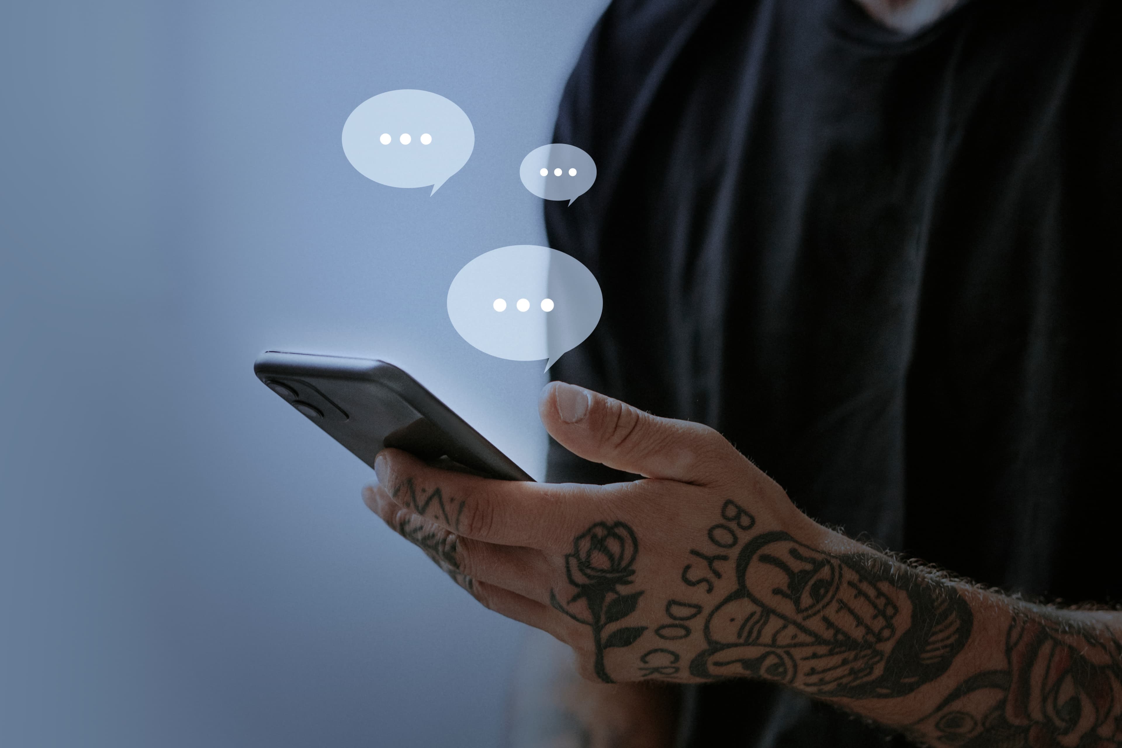SMS Broadcast Service - Person holding smartphone with chat bubbles